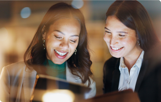 Two women looking at tablet