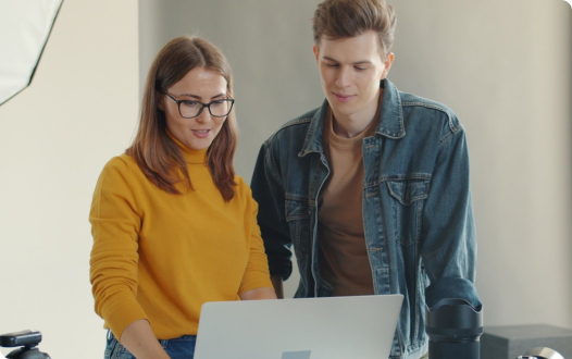 Woman and man on laptop